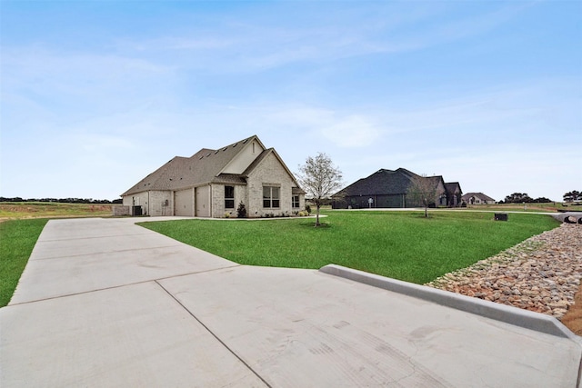 french provincial home featuring a front lawn