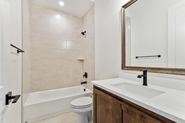 bathroom featuring tile patterned flooring, tub / shower combination, vanity, and toilet