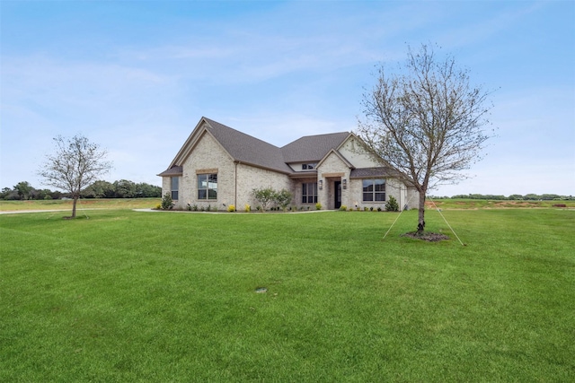 french provincial home featuring a front lawn