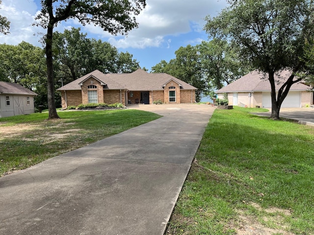 single story home with a front lawn and a garage