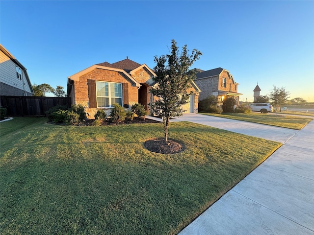 view of front of house with a front lawn and a garage