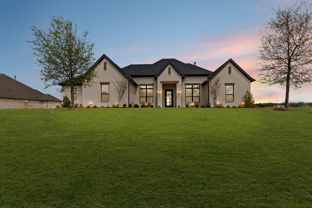 view of front of property with a front lawn