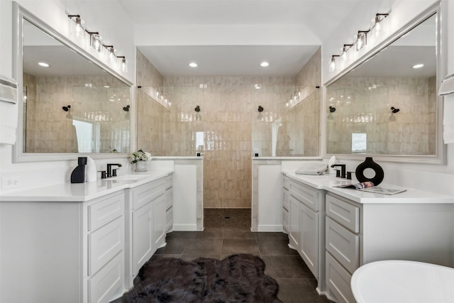 bathroom with vanity, shower with separate bathtub, tile patterned flooring, and tile walls