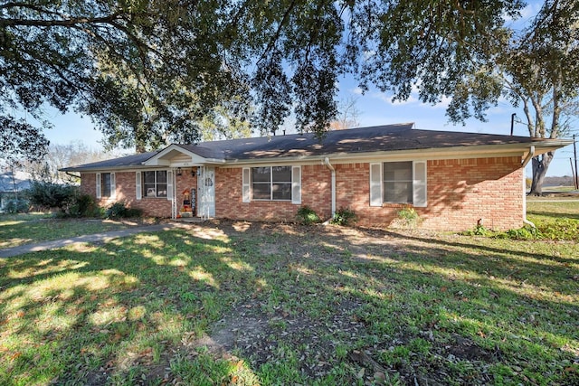 ranch-style home with a front yard