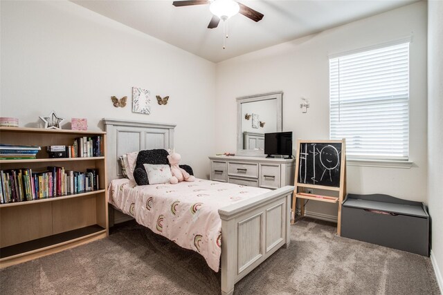 carpeted living room with ceiling fan, vaulted ceiling, and a wealth of natural light