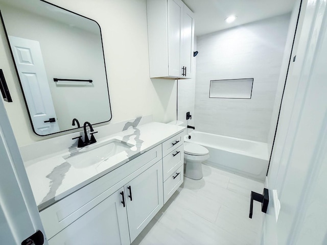 full bathroom featuring tiled shower / bath combo, vanity, and toilet