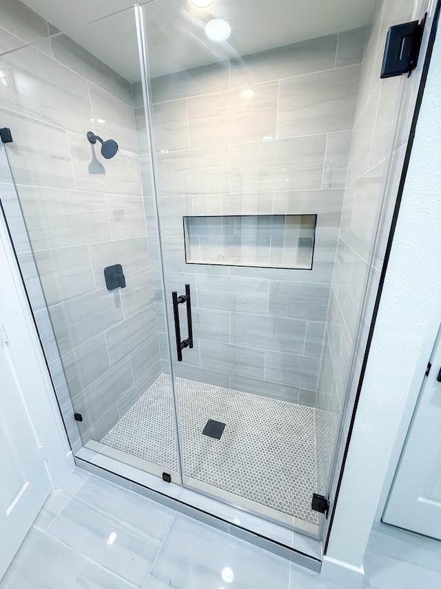 bathroom featuring a shower stall