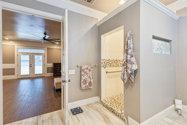 bathroom with french doors, wood-type flooring, ceiling fan, and crown molding