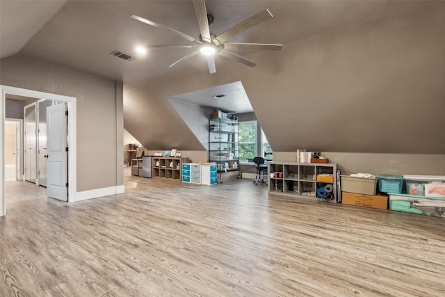 additional living space with lofted ceiling, hardwood / wood-style flooring, and ceiling fan