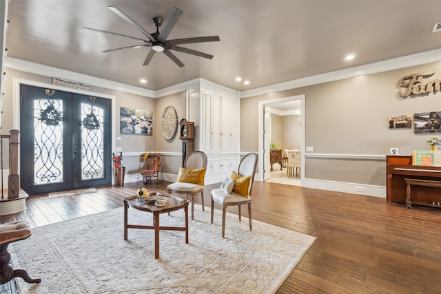 living room with ornamental molding, ceiling fan, french doors, and wood-type flooring