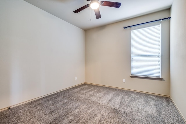 empty room featuring ceiling fan and carpet flooring