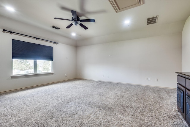 unfurnished living room with ceiling fan and light carpet