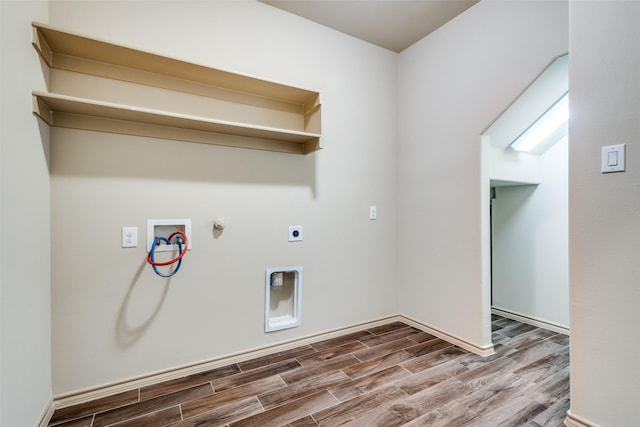 laundry room featuring gas dryer hookup, hardwood / wood-style flooring, hookup for a washing machine, and hookup for an electric dryer