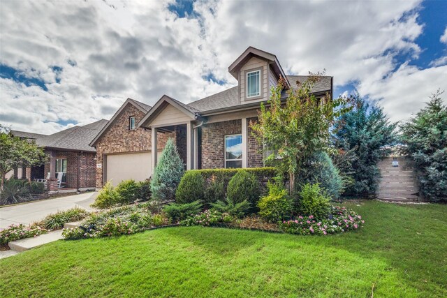 view of front facade with a garage and a front yard