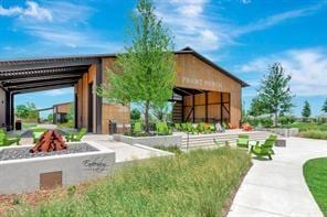 surrounding community featuring a fire pit