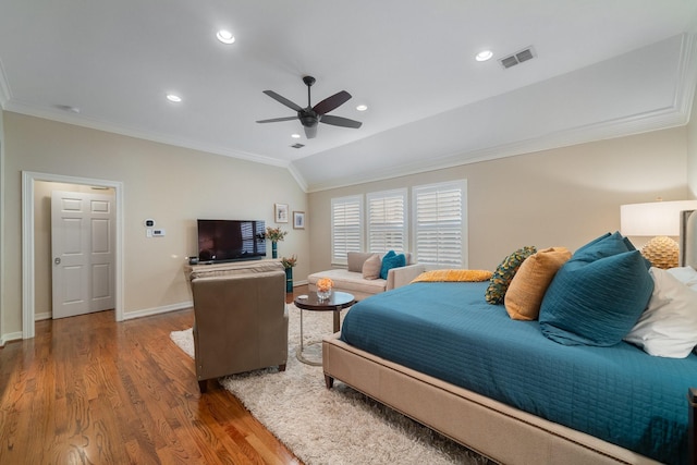 bedroom with lofted ceiling, hardwood / wood-style floors, ceiling fan, and ornamental molding