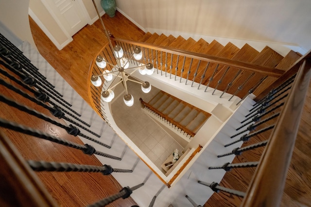 stairs with hardwood / wood-style flooring