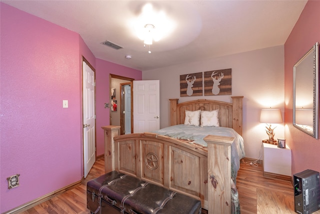 bedroom with light hardwood / wood-style flooring