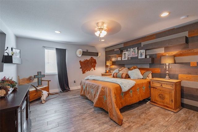 bedroom featuring hardwood / wood-style floors and ceiling fan