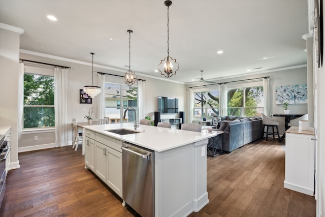 kitchen with stainless steel appliances, a kitchen island with sink, white cabinets, ceiling fan, and sink