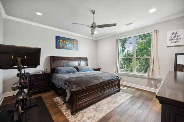 bedroom featuring dark wood-type flooring, ceiling fan, and crown molding