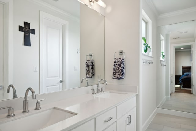 bathroom with ornamental molding, tile patterned floors, and vanity