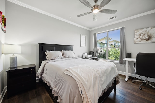 bedroom with ceiling fan, dark wood-type flooring, and ornamental molding