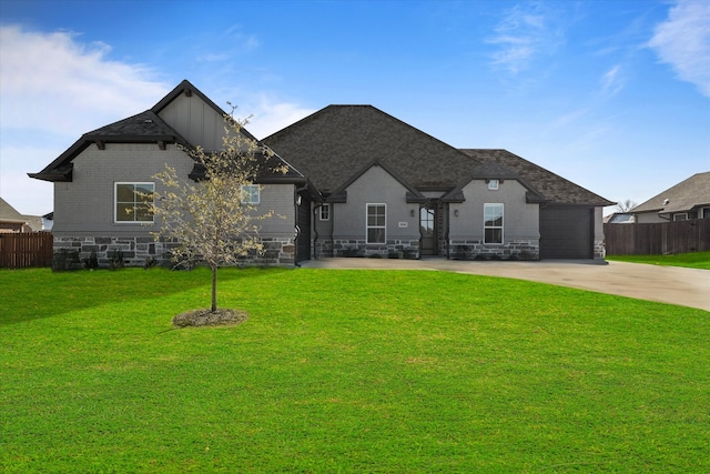 french country inspired facade featuring a front yard and a garage