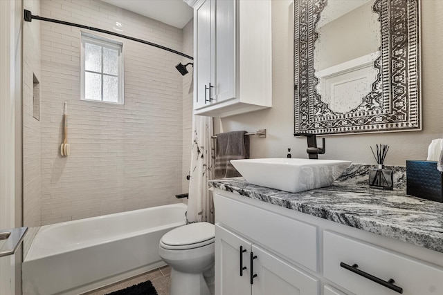 full bathroom with toilet, vanity, tile patterned flooring, and shower / tub combo with curtain