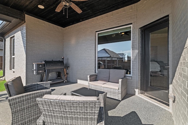 view of patio / terrace featuring ceiling fan, area for grilling, and an outdoor living space