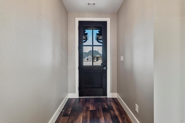 entryway with dark hardwood / wood-style floors