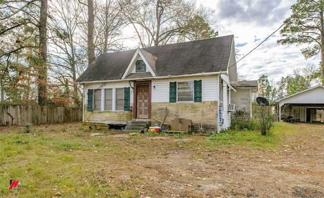 view of front of property featuring a carport