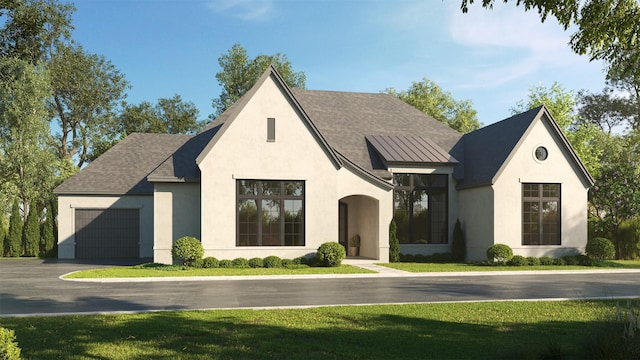 view of front facade featuring a front yard and a garage