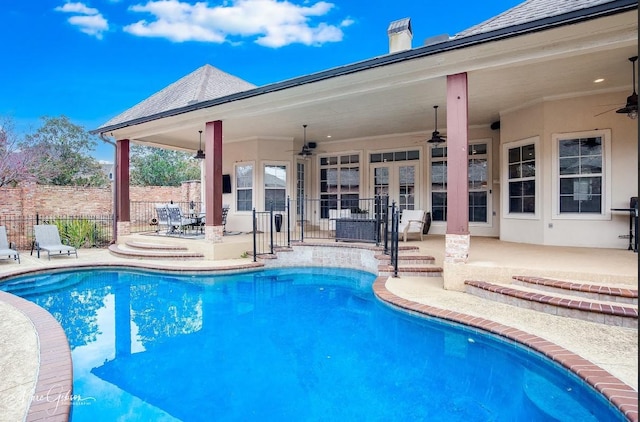 view of pool featuring ceiling fan and a patio