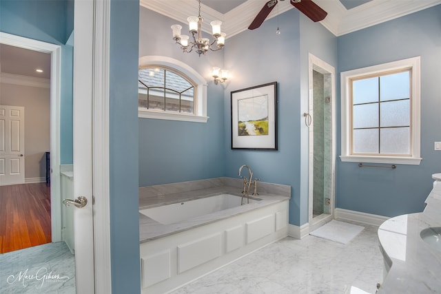 bathroom featuring independent shower and bath, ceiling fan with notable chandelier, and ornamental molding