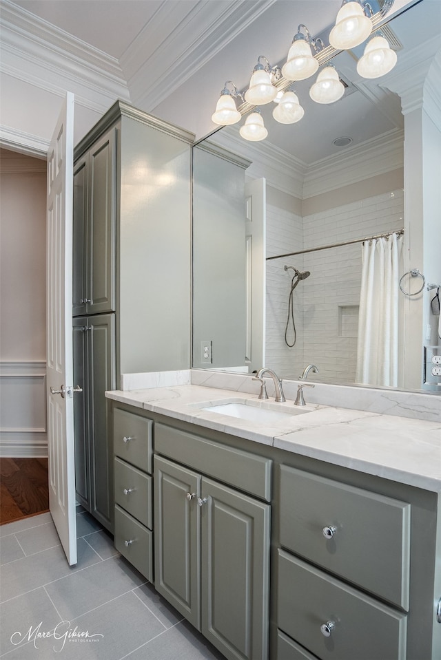 bathroom featuring crown molding, vanity, a shower with shower curtain, and tile patterned flooring