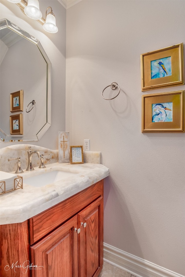 bathroom with vanity and crown molding