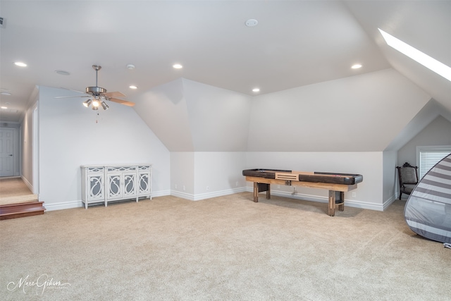 additional living space featuring ceiling fan, light carpet, and vaulted ceiling