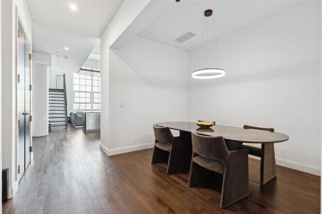 dining room with dark wood-type flooring