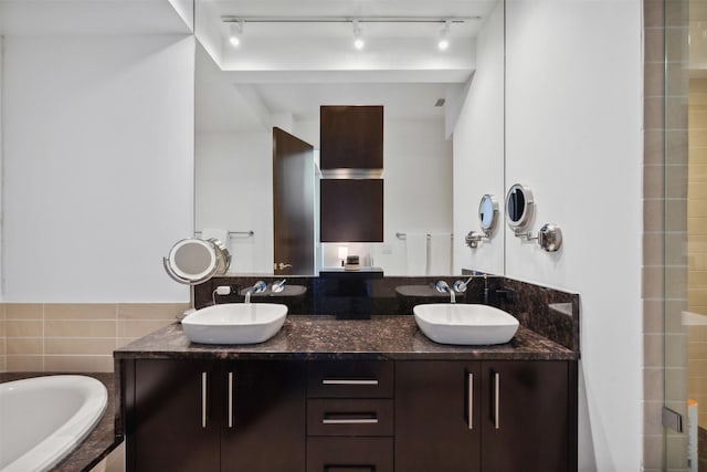 bathroom featuring vanity and plus walk in shower