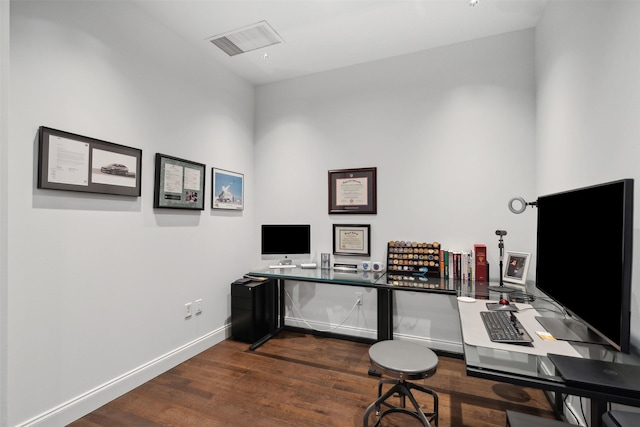 office space with dark wood-type flooring