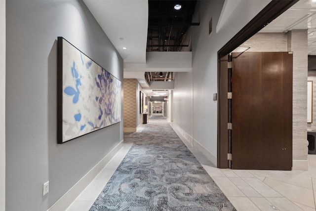 hallway featuring light tile patterned flooring