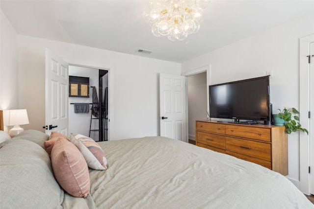 bedroom featuring a chandelier