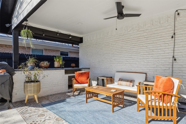 view of patio / terrace with ceiling fan and outdoor lounge area