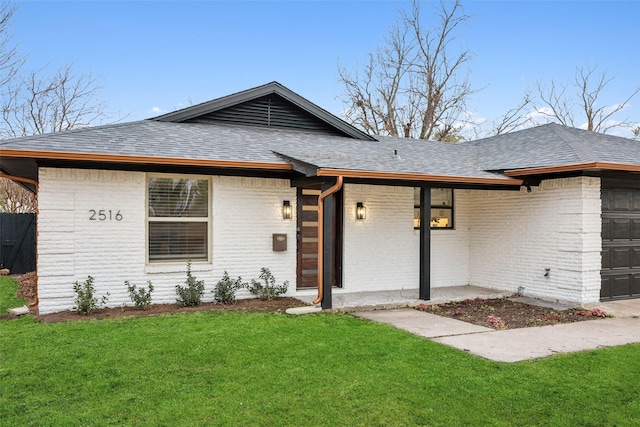 ranch-style home featuring a front yard and a garage