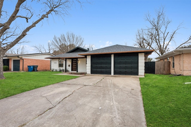 ranch-style house featuring a front lawn and a garage