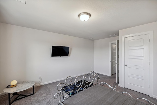 bedroom featuring dark colored carpet