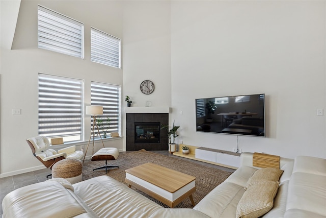 tiled living room featuring a fireplace