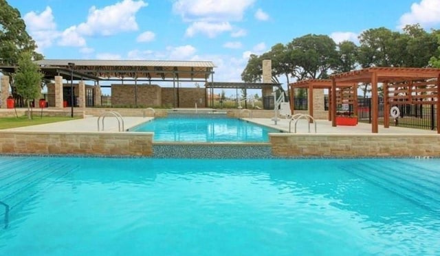 view of swimming pool with a pergola