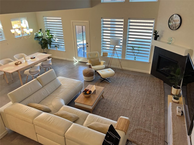 living room featuring a notable chandelier and plenty of natural light